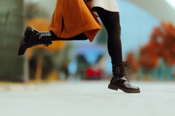 Girl in a hurry jumping in patent leather autumn shoes