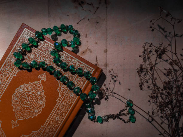 Quran - holy book of Muslims and prayer beads or tasbih