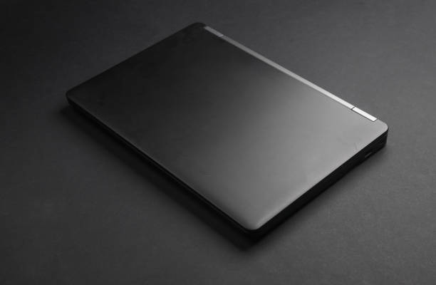 Black closed laptop or ultrabook on a black background